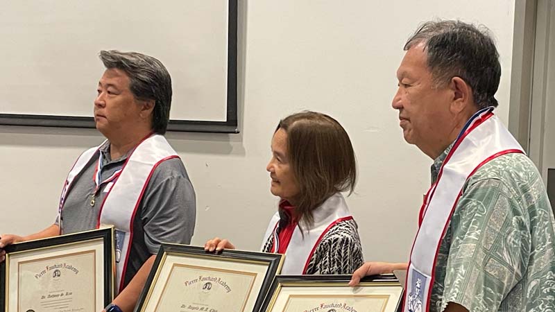 Inductees taking the pledge are Anthony Kim, Angela Chin and Riichiro Sato photo